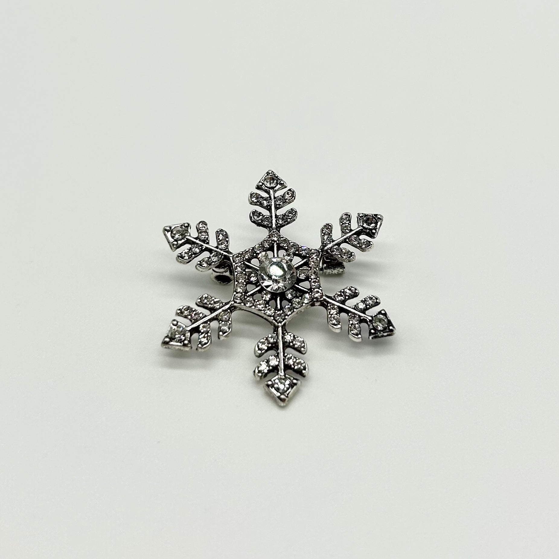 Snowflake brooch deals